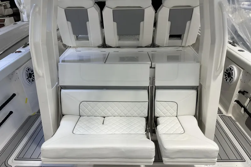 Slide: The Image of 2022 Pursuit S 358 Sport boat interior with white cushioned seating. - 25