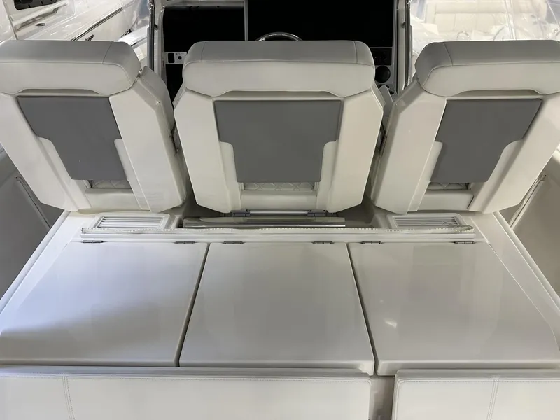 Slide: The Image of 2022 Pursuit S 358 Sport boat interior with sleek white seating. - 26