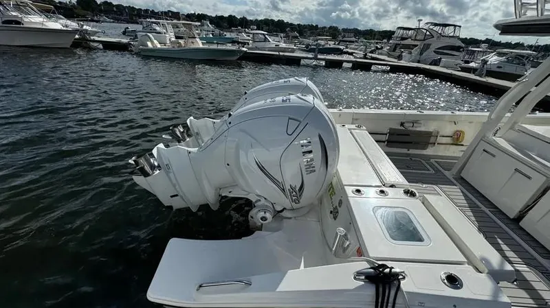 Slide: The Image of 2022 Pursuit S 358 Sport boat with Yamaha outboard engines docked in a marina. - 7