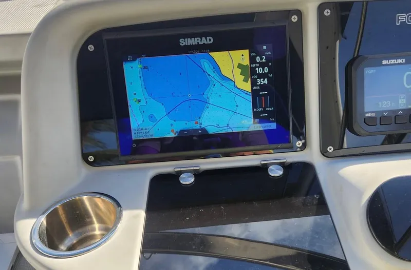 Slide: The Image of Simrad navigation display on 2008 Formula 330 Sun Sport boat dashboard. - 11