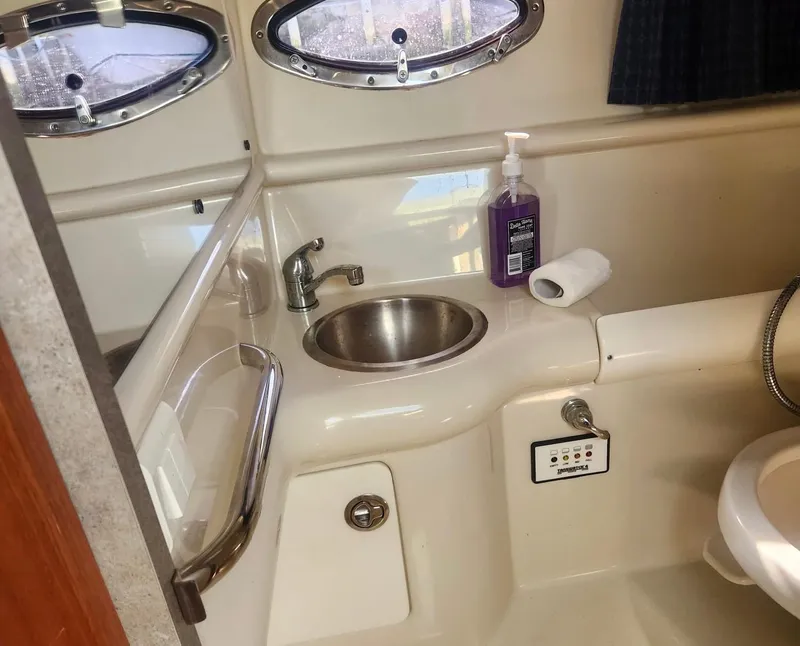 Slide: The Image of 2008 Formula 330 Sun Sport bathroom with sink, portholes, and soap dispenser. - 21
