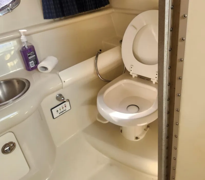 Slide: The Image of 2008 Formula 330 Sun Sport boat bathroom with toilet and sink. - 22