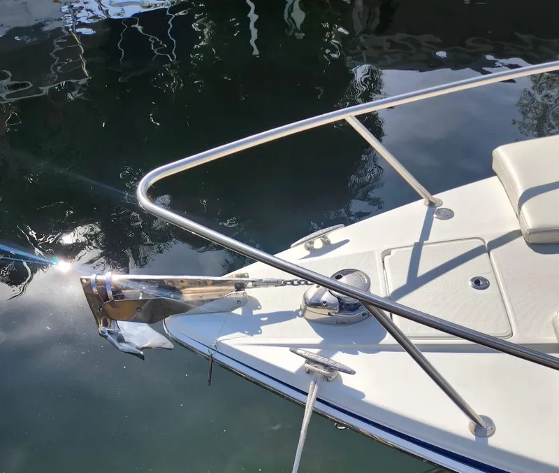 Slide: The Image of 2008 Formula 330 Sun Sport boat bow with anchor and railing on calm water. - 25
