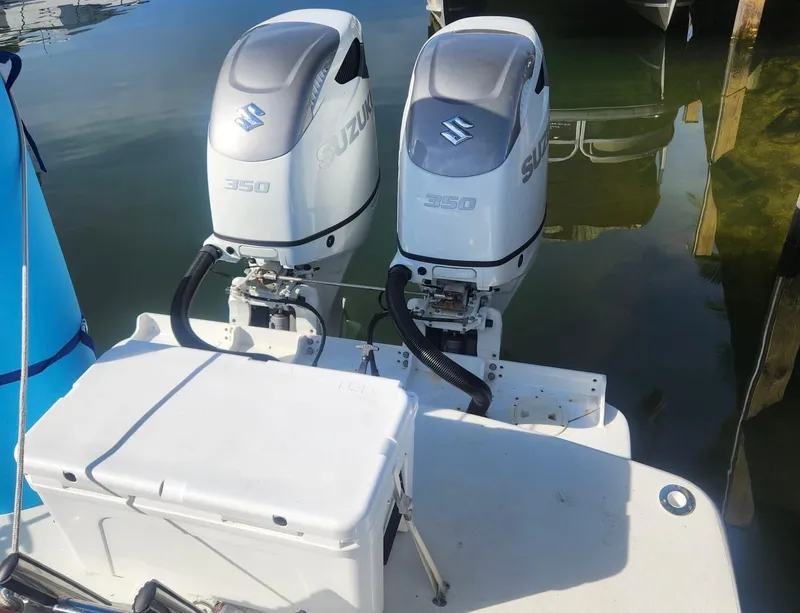 Slide: The Image of Twin Suzuki 350 outboard motors on a 2008 Formula 330 Sun Sport boat. - 3