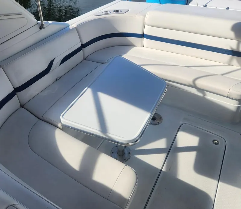 Slide: The Image of 2008 Formula 330 Sun Sport boat interior with white seating and table. - 5