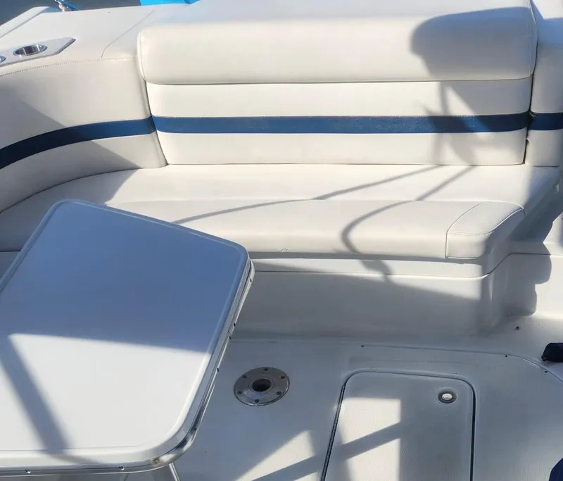 Slide: The Image of 2008 Formula 330 Sun Sport boat interior with white seating and table. - 6