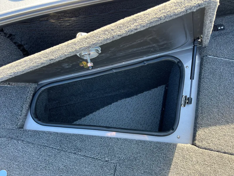 Slide: The Image of Open storage compartment in 2025 Lund 1875 Pro-V boat. - 13