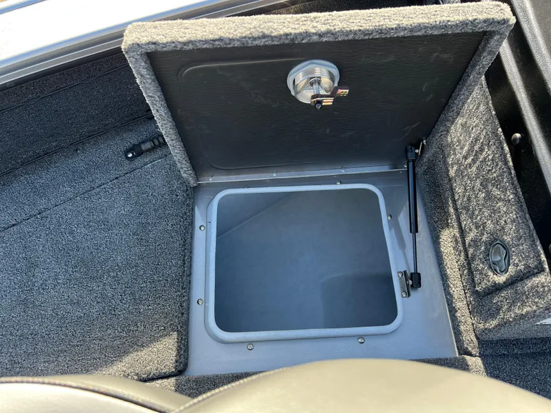 Slide: The Image of Open storage compartment in 2025 Lund 1875 Pro-V boat. - 14