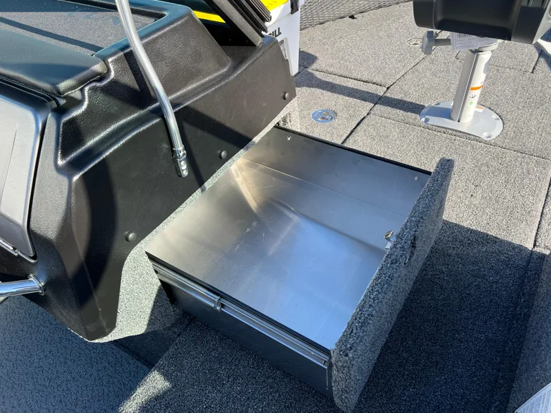 Slide: The Image of 2025 Lund 1875 Pro-V boat with open storage compartment on deck. - 21