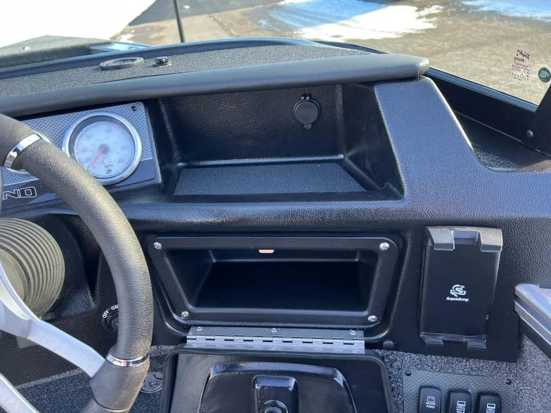 Slide: The Image of Dashboard of 2025 Lund 1875 Pro-V boat with steering wheel and gauge. - 26