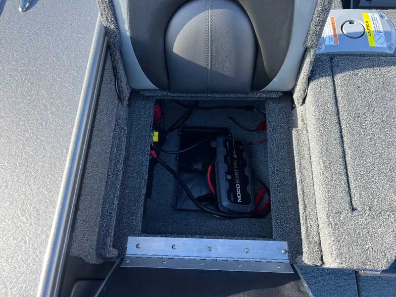 Slide: The Image of 2025 Lund 1875 Pro-V boat battery compartment with wiring and seating. - 37