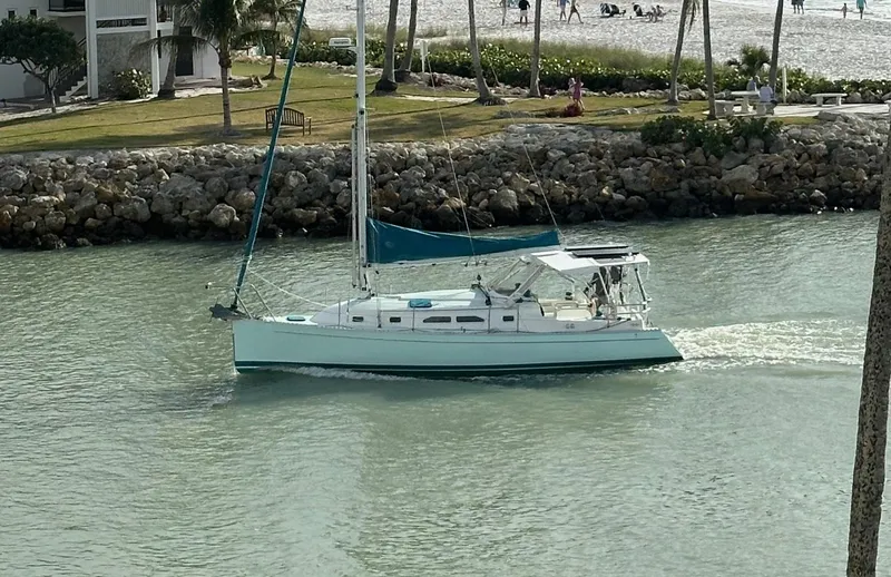 The Image of Sailboat cruising near shore, Shannon Shoalsailer 2006, in calm waters. - 0
