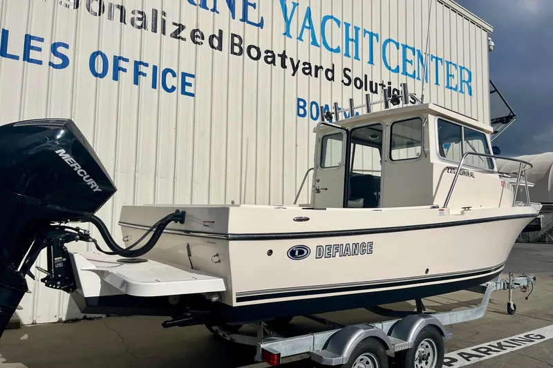 Slide: The Image of 2023 Defiance Admiral 220 EX boat on trailer at marine center. - 7