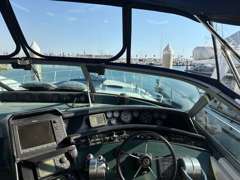 Slide: The Image of Cockpit view of 1991 Sea Ray Sun Dancer 480 Express at marina. - 26