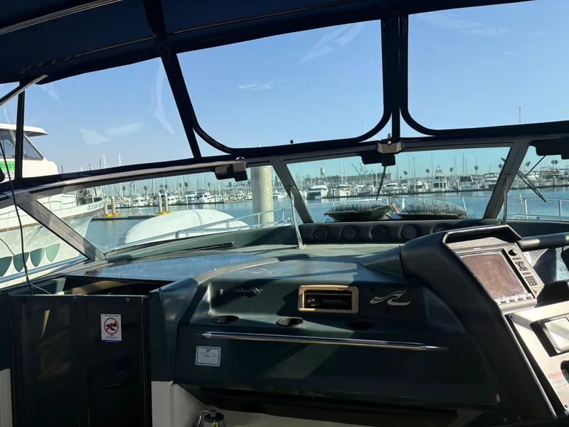 Slide: The Image of Cockpit view of 1991 Sea Ray Sun Dancer 480 Express at marina. - 28