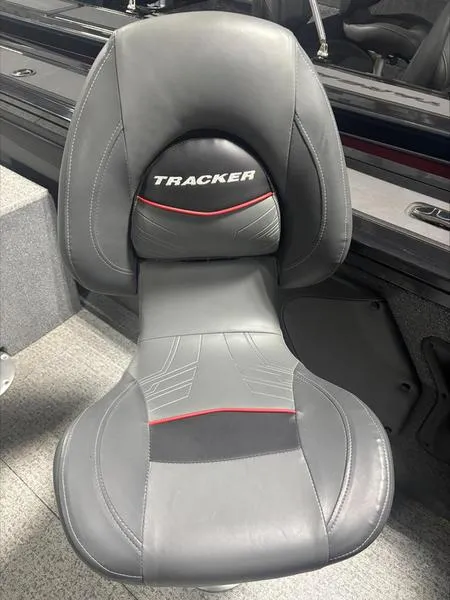 Slide: The Image of 2025 Tracker Targa™ V-18 WT boat seat, black and gray with red accents. - 7