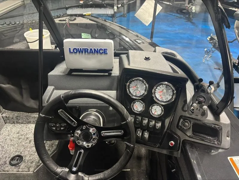 Slide: The Image of 2025 Tracker Targa™ V-18 WT dashboard with Lowrance display and gauges. - 9