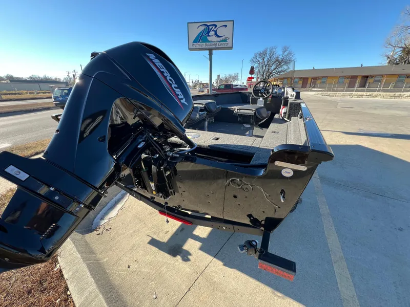Slide: The Image of 2025 Lund 1650 Rebel XL SS boat with Mercury outboard motor, parked outdoors. - 3