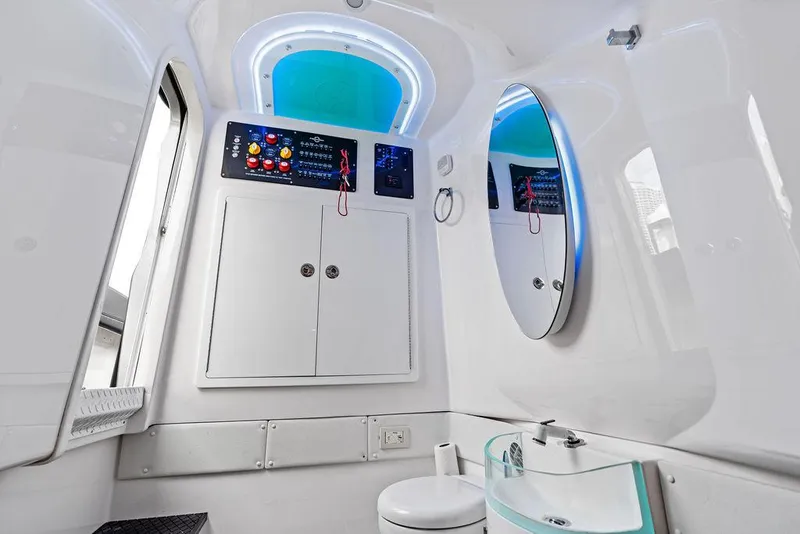 Slide: The Image of Interior of 2021 Fountain 39 NX boat bathroom with modern design and blue lighting. - 23