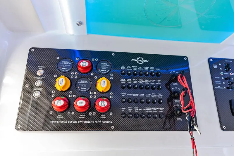 Slide: The Image of Control panel of 2021 Fountain 39 NX boat with switches and wiring. - 24