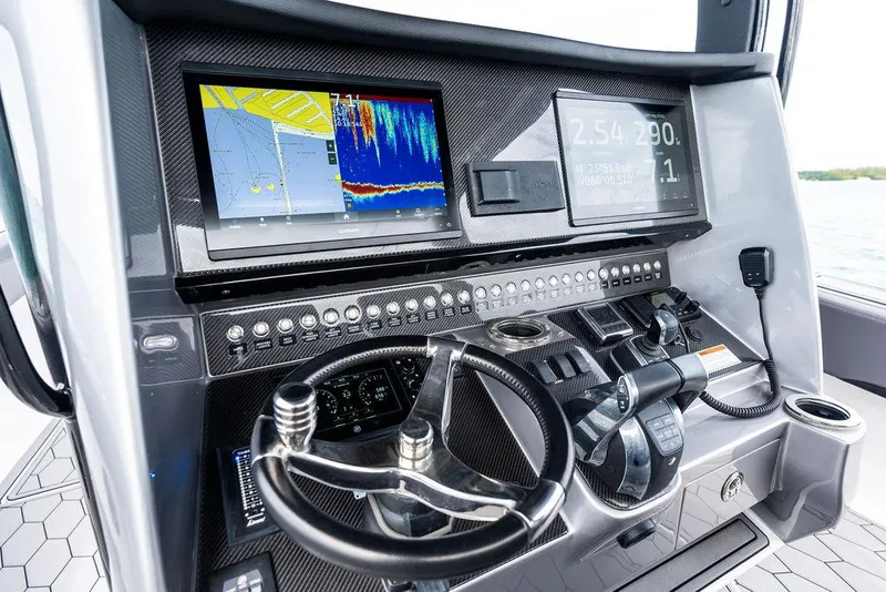Slide: The Image of Control panel of 2021 Fountain 39 NX boat with advanced navigation displays. - 15