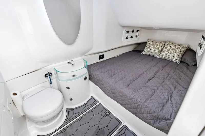 Slide: The Image of 2021 Fountain 39 NX cabin interior with bed, toilet, and sink. - 22