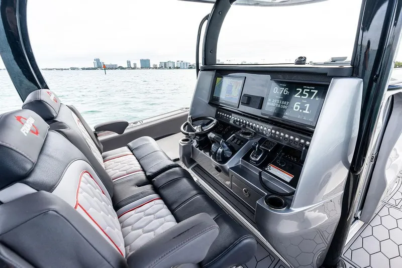 Slide: The Image of 2021 Fountain 39 NX boat cockpit with advanced navigation system and luxurious seating. - 13
