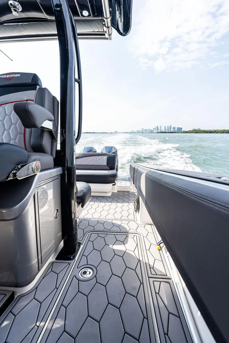 Slide: The Image of 2021 Fountain 39 NX boat interior with modern seating and ocean view. - 17