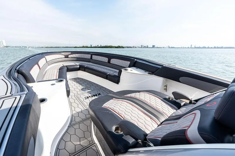 Slide: The Image of 2021 Fountain 39 NX boat interior with luxurious seating and scenic water view. - 19