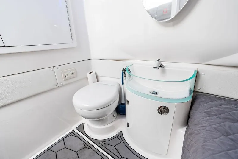 Slide: The Image of Modern bathroom in 2021 Fountain 39 NX boat with toilet and sleek sink design. - 21