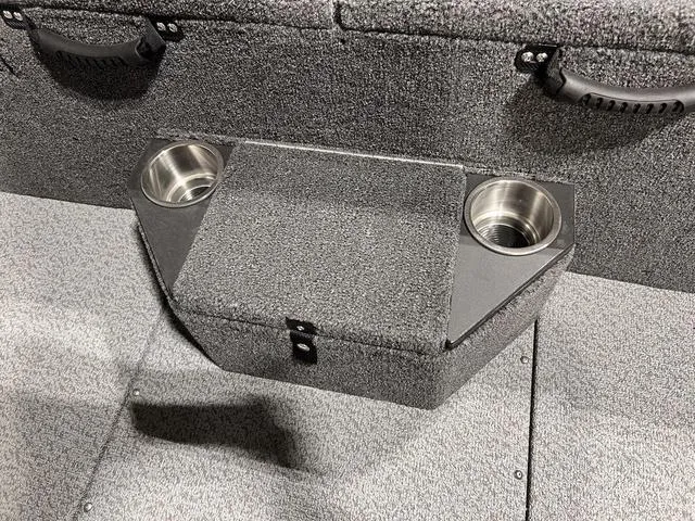 Slide: The Image of 2025 Lund 2075 Pro-V Bass XS boat interior with cup holders and textured flooring. - 12