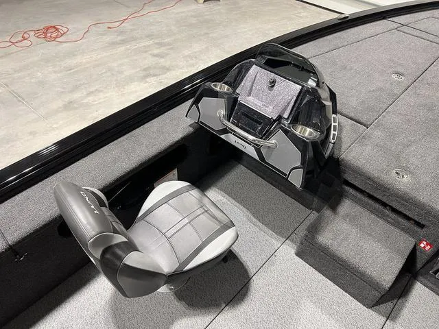 Slide: The Image of 2025 Lund 2075 Pro-V Bass XS boat interior with seating and console. - 14