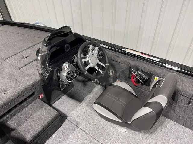 Slide: The Image of 2025 Lund 2075 Pro-V Bass XS boat interior with steering console and seating. - 17