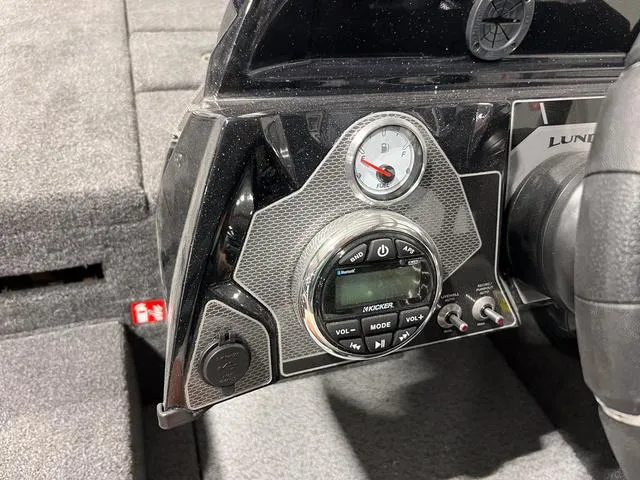Slide: The Image of Dashboard of 2025 Lund 2075 Pro-V Bass XS with audio controls and gauge. - 20