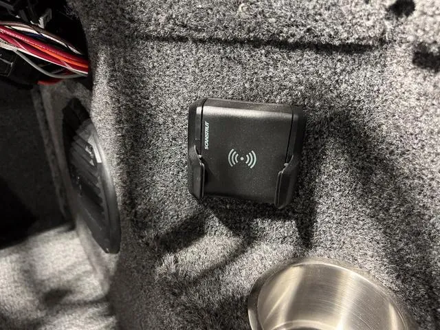 Slide: The Image of 2025 Lund 2075 Pro-V Bass XS interior with wireless charging pad and speaker. - 22