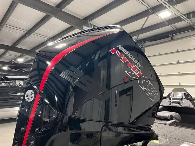 Slide: The Image of 2025 Lund 2075 Pro-V Bass XS with Mercury Pro XS engine in a showroom. - 6