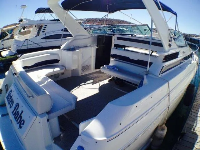 Slide: The Image of 1995 Wellcraft 3600 Martinique yacht with spacious deck and seating, docked at marina. - 15