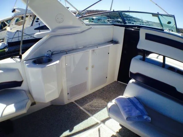 Slide: The Image of 1995 Wellcraft 3600 Martinique boat interior with seating and sink. - 22