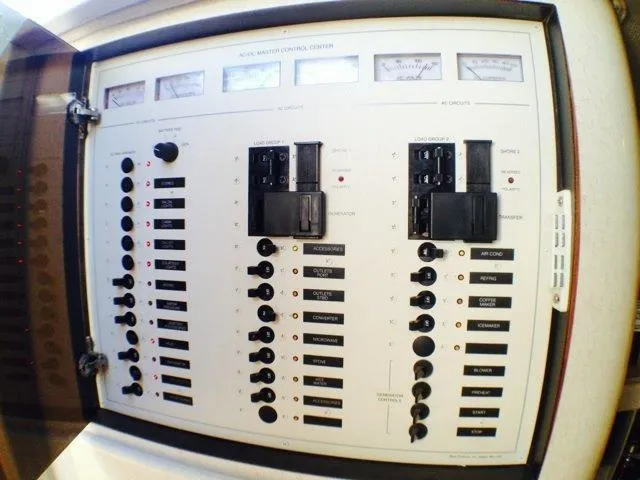 Slide: The Image of Control panel of a 1995 Wellcraft 3600 Martinique boat with switches and gauges. - 30