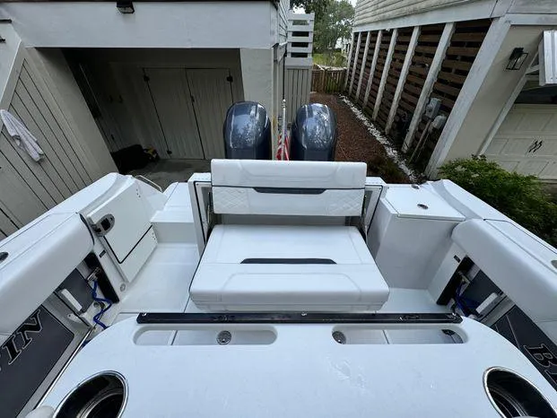 Slide: The Image of 2021 Blackfin 252 CC boat with dual engines and spacious seating area. - 18