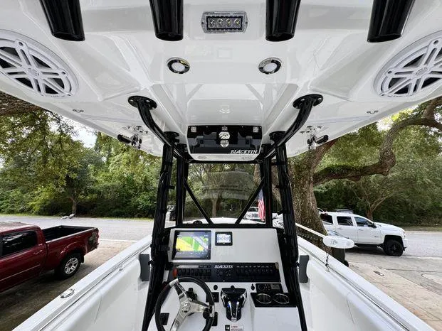 Slide: The Image of 2021 Blackfin 252 CC boat console with navigation system and speakers. - 23