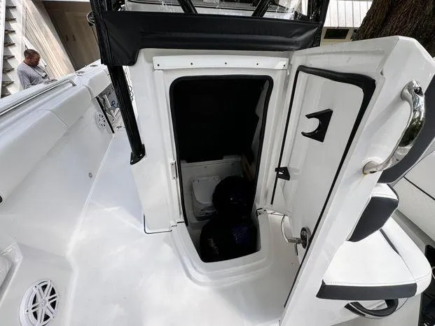 Slide: The Image of 2021 Blackfin 252 CC boat interior with open storage compartment. - 32