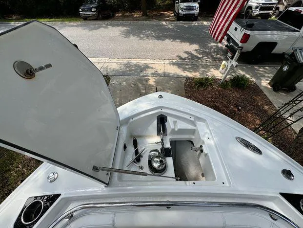 Slide: The Image of Open storage compartment on 2021 Blackfin 252 CC boat, parked near street. - 35