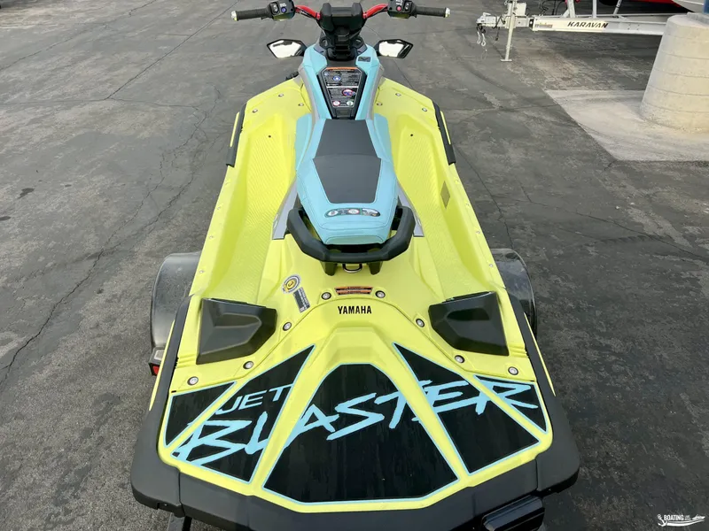 Slide: The Image of 2025 Yamaha WaveRunner Jet Blaster Pro-3 in vibrant yellow and blue, parked on pavement. - 4
