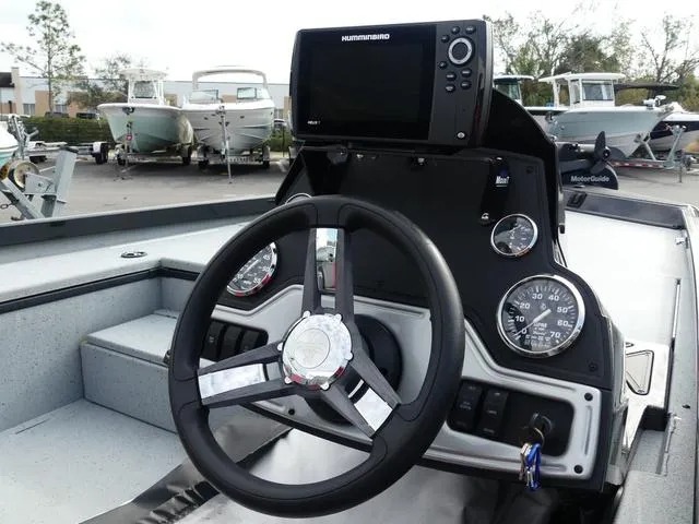 Slide: The Image of 2018 Ranger RT178 boat dashboard with steering wheel and Humminbird fishfinder. - 10