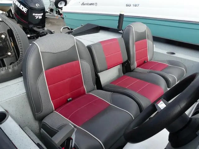 Slide: The Image of 2018 Ranger RT178 boat interior with red and gray seats. - 11