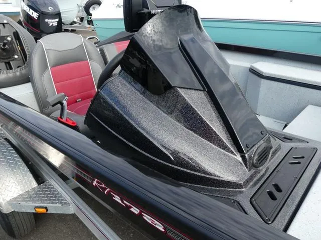 Slide: The Image of 2018 Ranger RT178 boat with sleek black console and red-accented seating. - 12