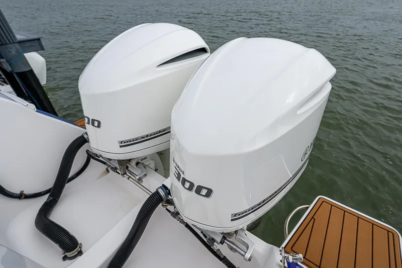 Slide: The Image of Twin outboard engines on 2014 Intrepid 327 Center Console boat. - 22