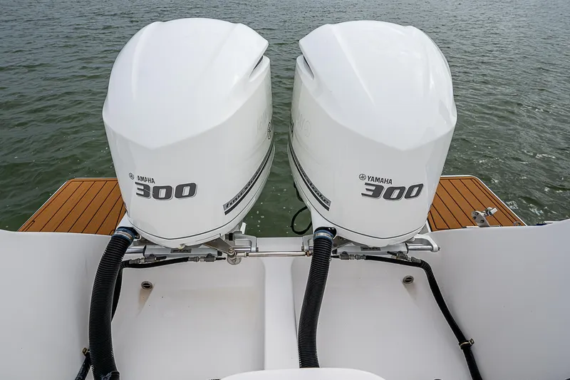 Slide: The Image of 2014 Intrepid 327 Center Console with twin Yamaha 300 engines on water. - 23