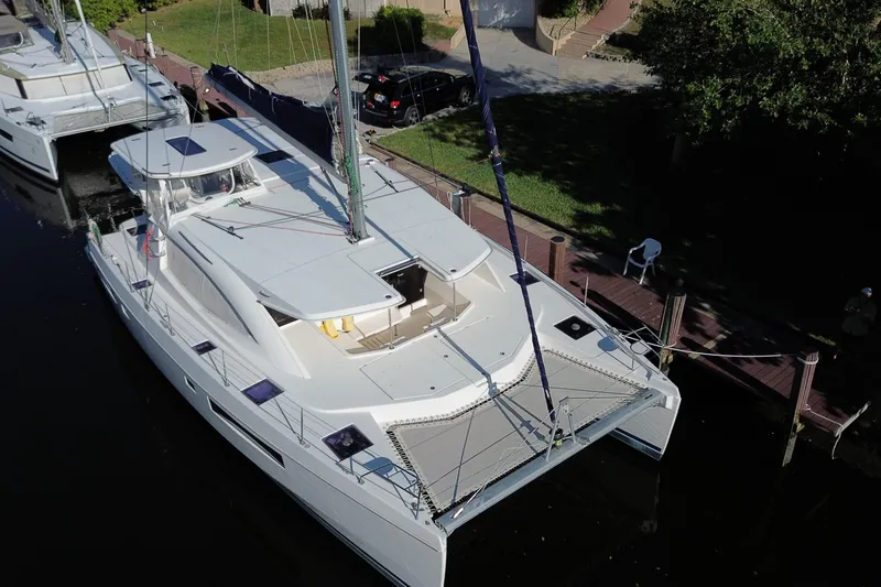The Image of 2017 Leopard 48 catamaran docked, aerial view showcasing sleek design and spacious deck. - 0